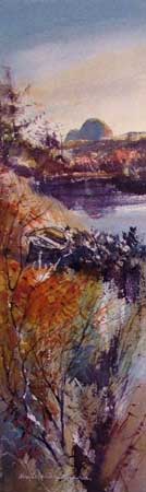 A red coloured landscape surrounds the mountain of Suilven